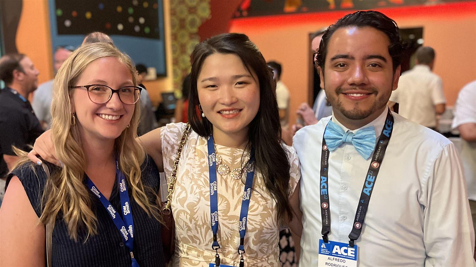 3 people at a conference Ji Maddie Alfredo