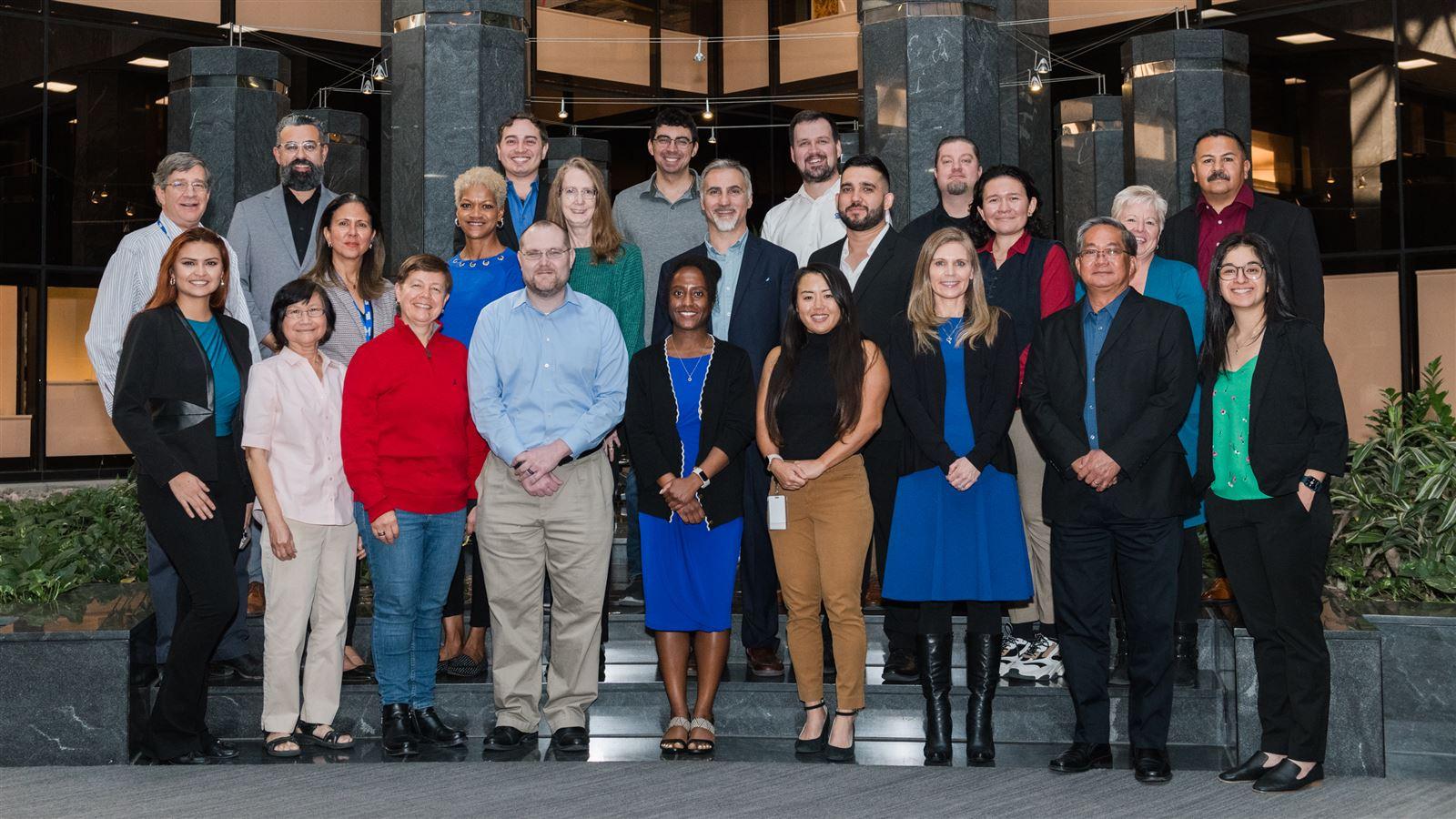 Jody Sweeten group photo in the Phoenix Office
