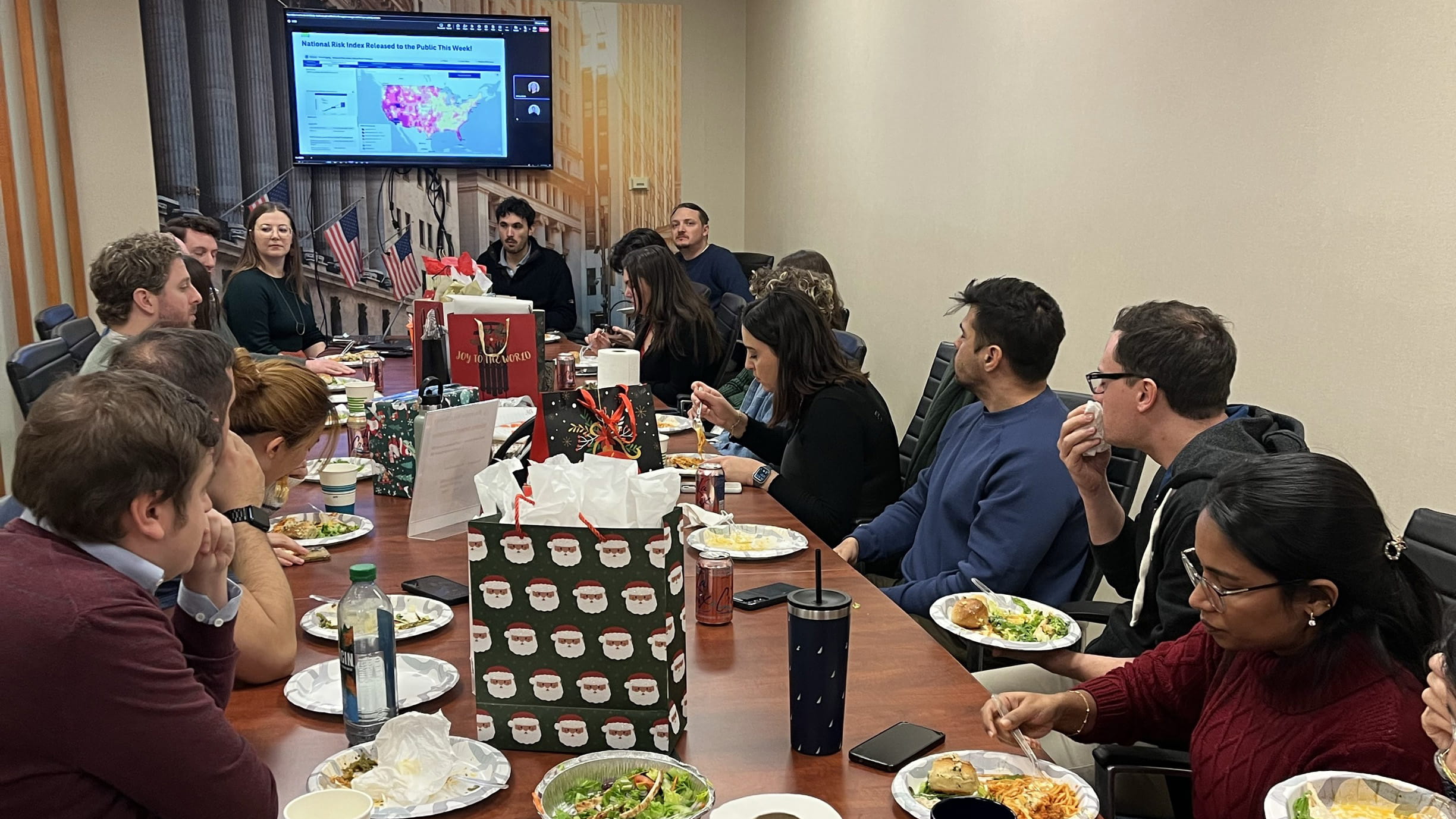 Natalie and 15 others at an office staff meeting