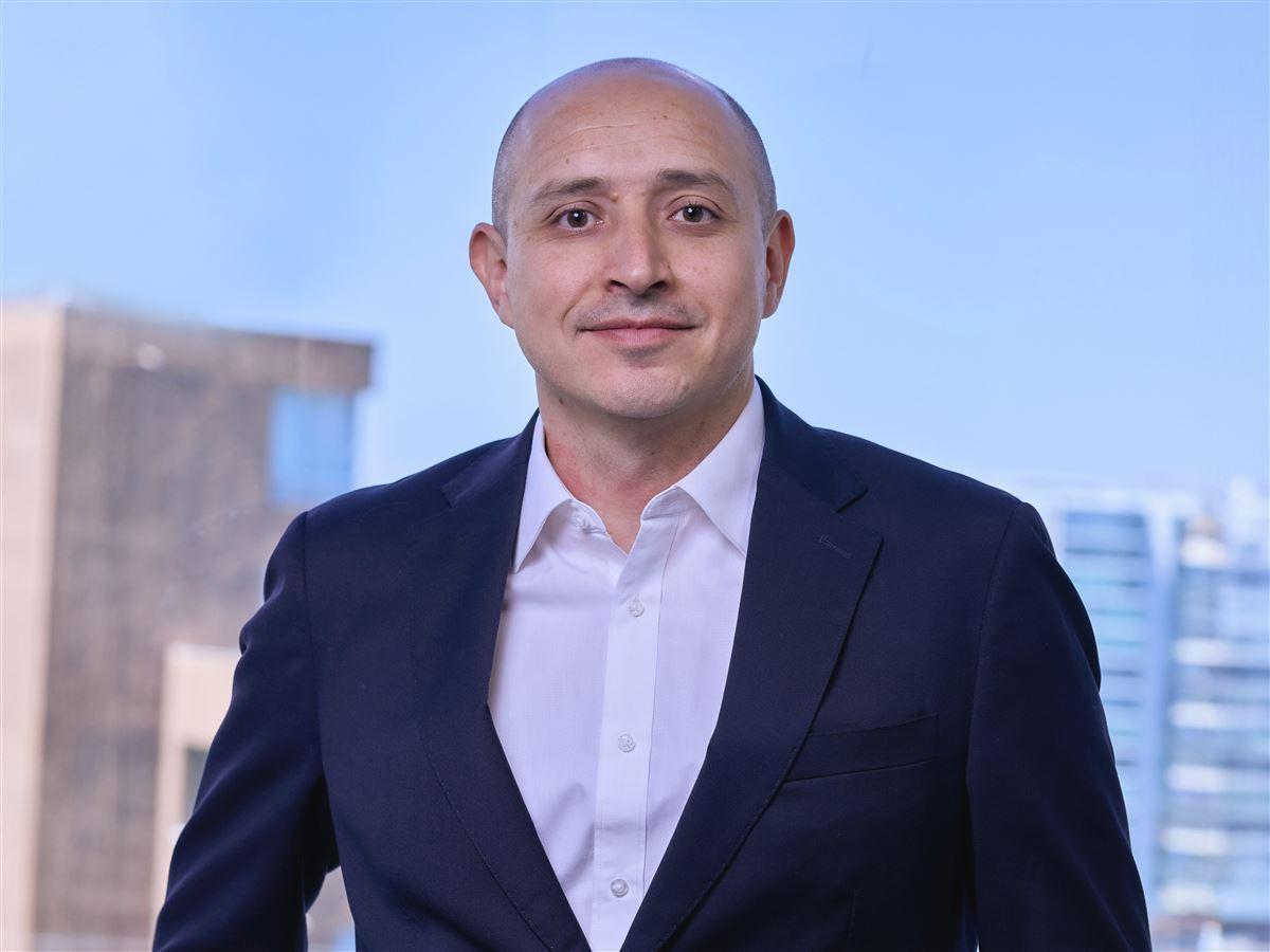 Nestor Rojas in dark suit