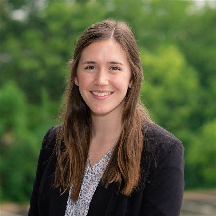 Portrait of Jessica Stanton in front of trees