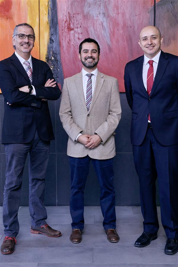 Group photo of three gentlemen in Chile