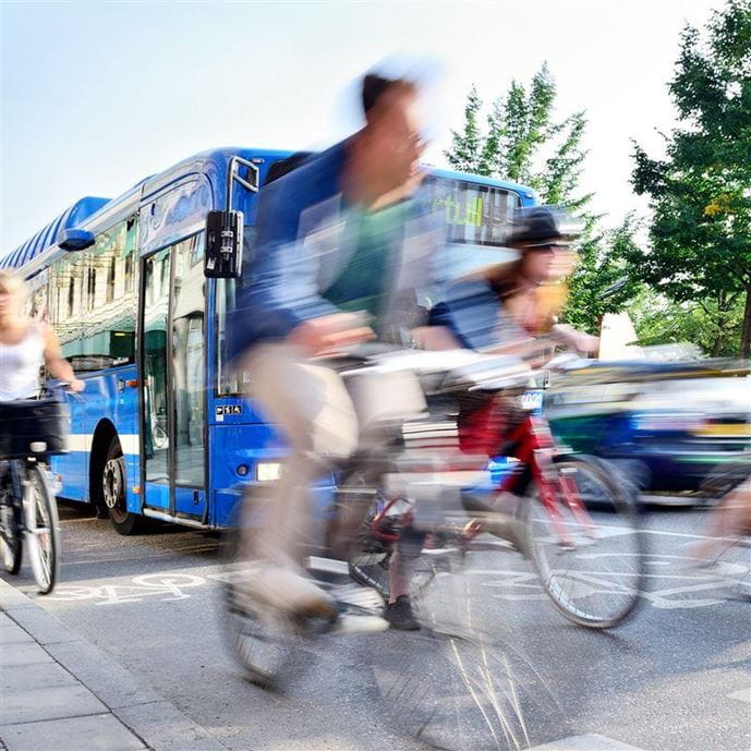 Busses and bikes share the road