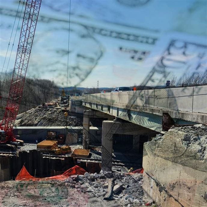 Hero image of money over infrastructure bridge building