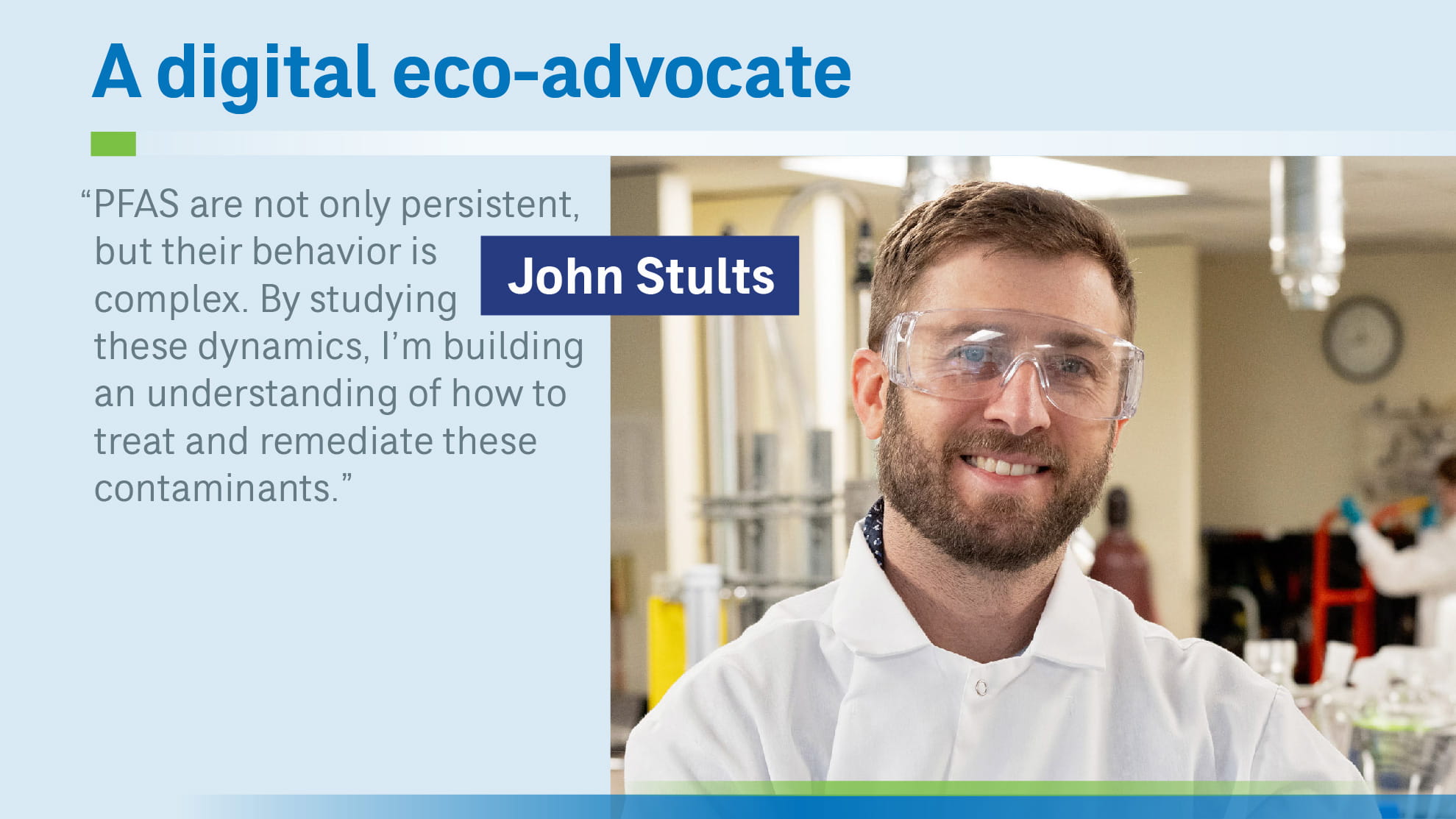 John Stults in lab looking at camera