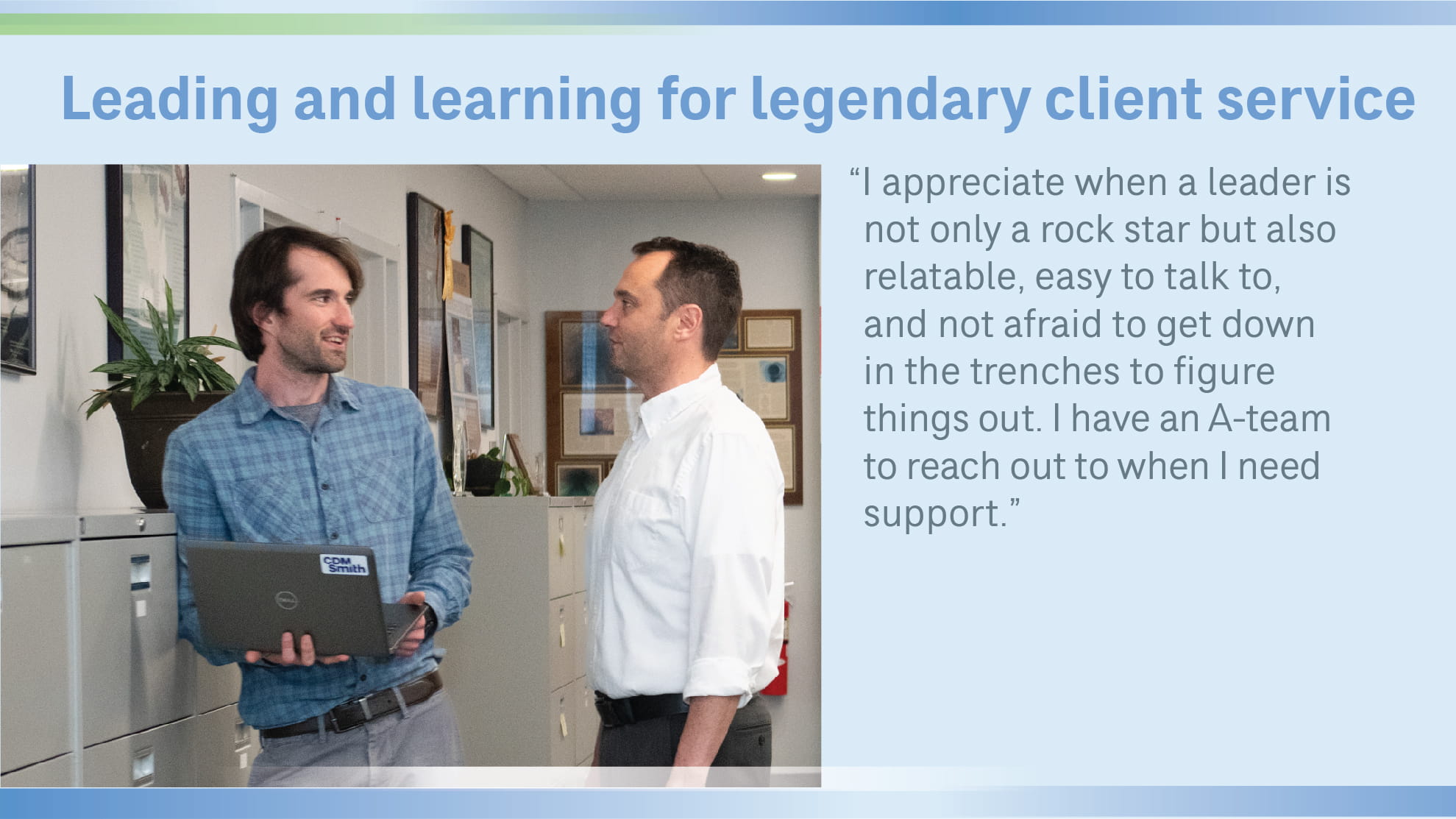 Sean Moore in office with another employee