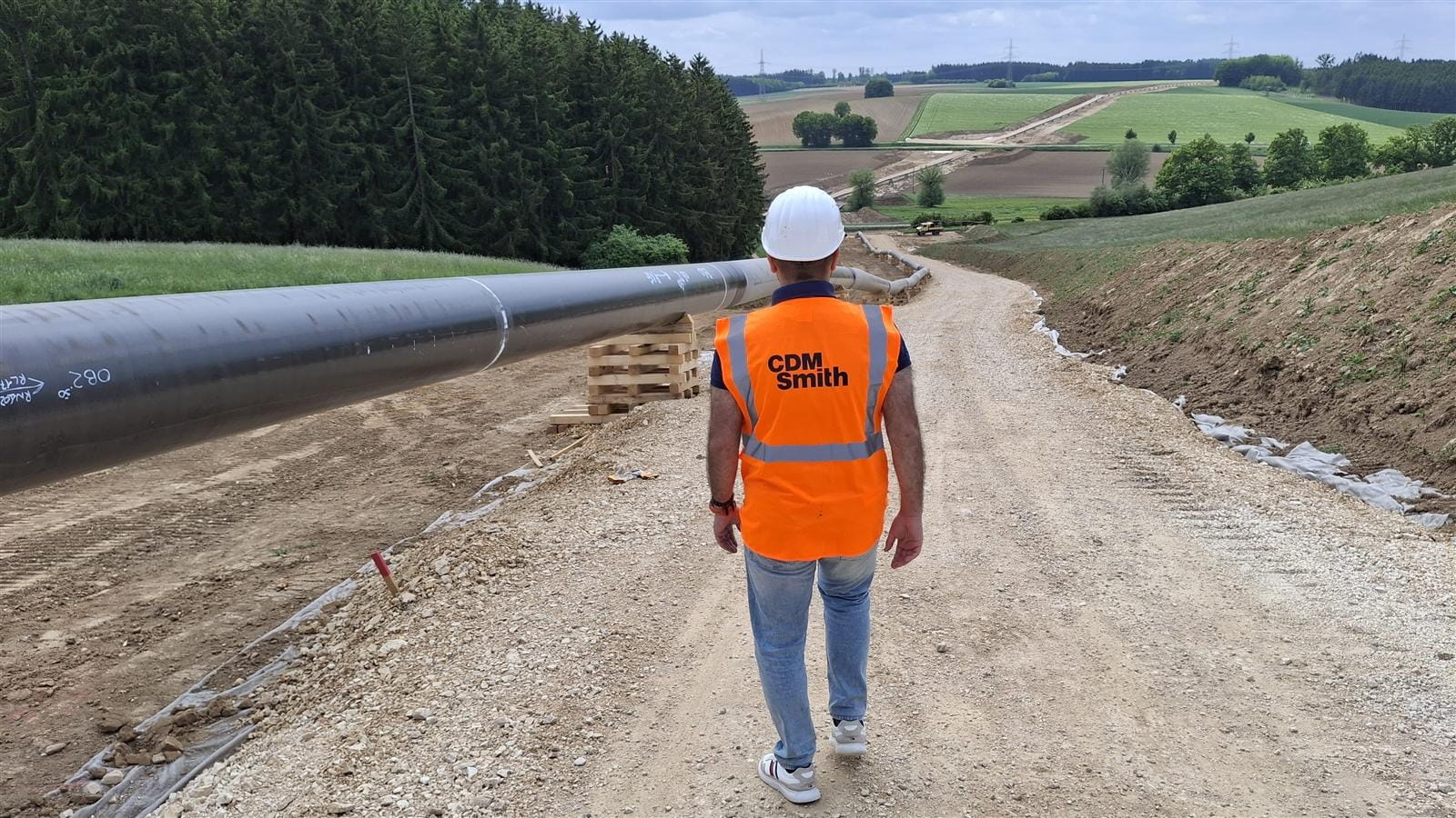 Lokman Ahmo at AUGUSTA gas transportation line with pipelines on the left