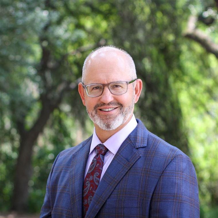 Headshot of John McGuiggin