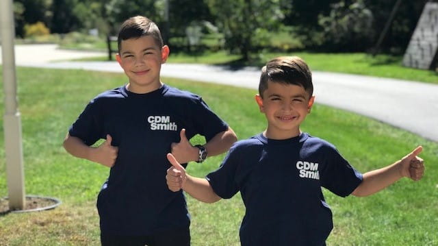 A future scientist and architect wear the CDM Smith t-shirt benefitting Latino STEM Alliance