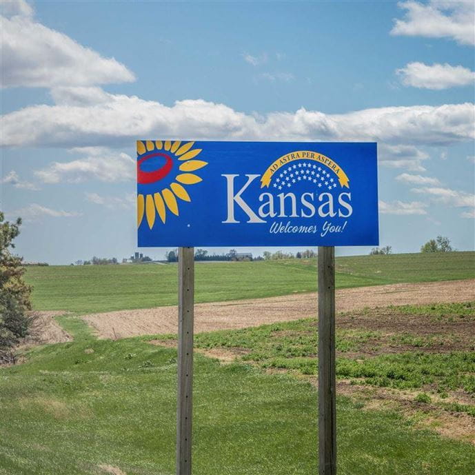Welcome to Kansas sign with odometer graphic